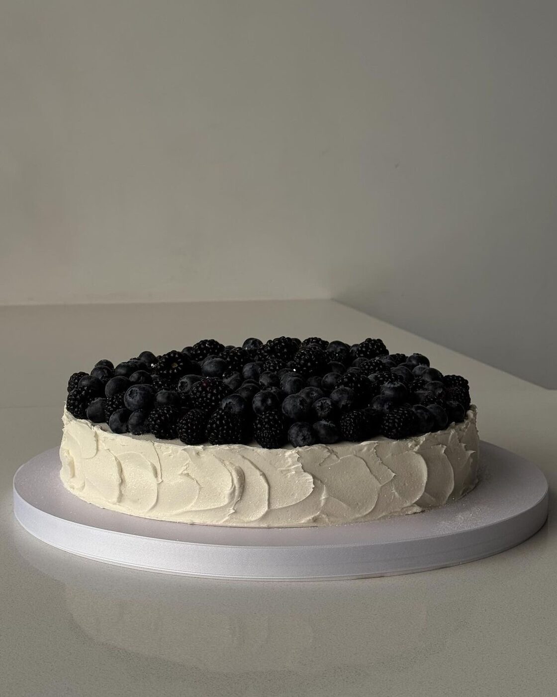 Textured Medovik cake crowned with blackberries